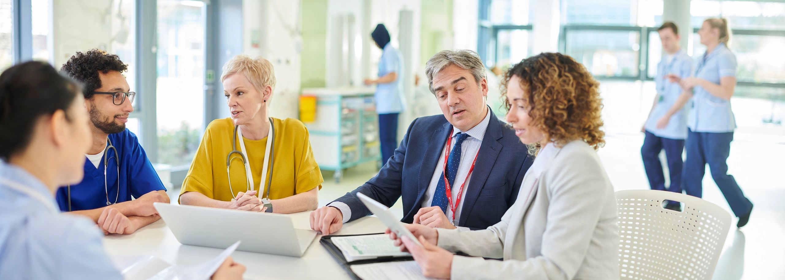 Clinicians collaborating at a medical conference