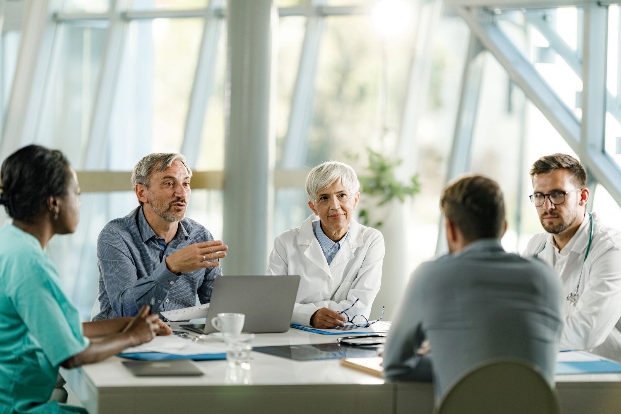 Healthcare professionals collaborating in a conference room.
