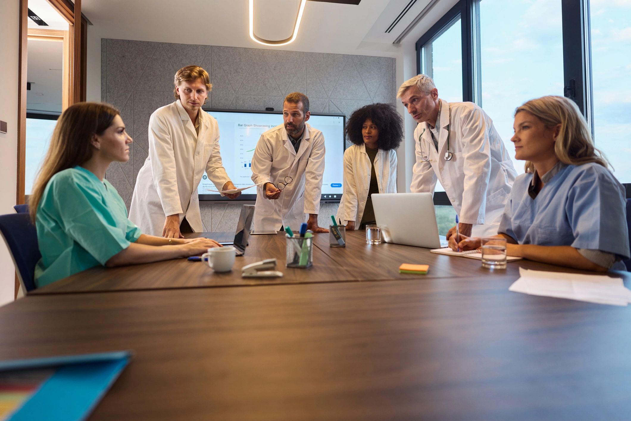 Clinicians collaborating during a professional discussion.